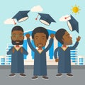 Three men throwing graduation cap