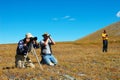 Three mens photographing a wonder of nature.