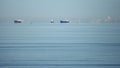 Three merchant ships on calm waters Royalty Free Stock Photo