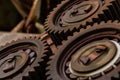 Three meshing gears on the machine. Old rusty industrial mechanism. background Royalty Free Stock Photo