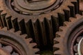 Three meshing gears on the machine. Old rusty industrial mechanism. background