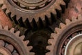 Three meshing gears on the machine. Old rusty industrial mechanism. background Royalty Free Stock Photo