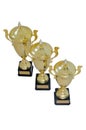 Three metal award cups of different height of gold color