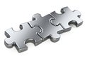 Three metallic puzzle pieces. Royalty Free Stock Photo