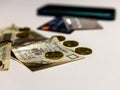 Three methods of payment. Photo of polish money with contemporary credit cards and contactless ready phone in out of focus on