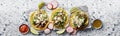 Three mexican street tacos with barbacoa and queso fresco cheese