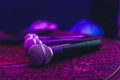 three Microphones in group on red table with copy space. Royalty Free Stock Photo