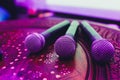 three Microphones in group on red table with copy space. Royalty Free Stock Photo