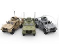 Three military all terrain vehicles - desert, jungle and urban camo colors