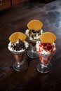 Three milkshakes in tall glasses with waffles Royalty Free Stock Photo