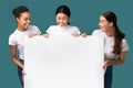 Three Millennial Girls Holding White Board Over Turquoise Background, Mockup Royalty Free Stock Photo