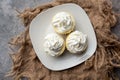 Three mini Cheesecakes with whipped cream icing on a white plate Royalty Free Stock Photo