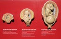 three miniature embryos and a baby with their mothers in their wombs