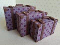 Three miniature suitcases for dolls Royalty Free Stock Photo