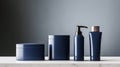 Three minimalist cosmetic jars in navy blue and white are displayed against a soft gradient background, perfect for