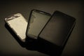 Three mobile phones, from the old model to the newer one Royalty Free Stock Photo