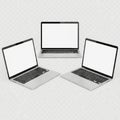 Three modern laptops displayed on a plain background Royalty Free Stock Photo