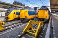 Three modern trains waiting at station