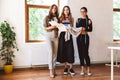 Three modern young women clothes designers