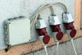 Three moisture protected electrical outlets on an outer wall