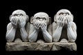 three monkeys made with marble white stone