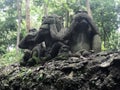 Three monkeys statues which have different posts. Cambodia Royalty Free Stock Photo