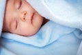 Three month old baby sleeping on blue blanket Royalty Free Stock Photo