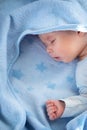 Three month old baby sleeping on blue blanket Royalty Free Stock Photo
