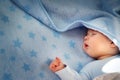 Three month old baby sleeping on blue blanket Royalty Free Stock Photo