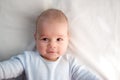 Three month old baby wrapped in blue blanket Royalty Free Stock Photo