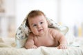 Three months ago baby lying wrapped towel after bathing Royalty Free Stock Photo