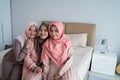 Three moslem woman smiling when look at the camera