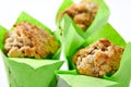 Three Muffins or Cupcakes in Green Paper Isolated