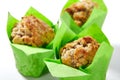 Three Muffins or Cupcakes in Green Paper Isolated