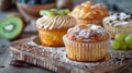 Three muffins on wooden board surrounded by grapes Royalty Free Stock Photo
