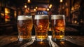 Three mugs of beer on the counter of a bar