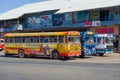 Three multi-colored `Ashok Leyland` buses