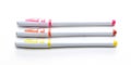 Three multi-colored ball point pens on a white Royalty Free Stock Photo