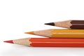 Three multi-colored pencils.