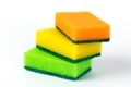Three multi-colored sponges for washing dishes isolated on white background Royalty Free Stock Photo