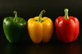 Three multi-coloured pepper