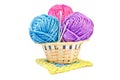 Three multicolored balls of yarn and three crochet