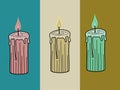 Three multicolored lit candles sitting horizontal