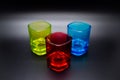 Three multicolored shot glasses on black background Royalty Free Stock Photo