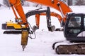 Dance of excavators in the snow