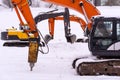 Dance of excavators in the snow
