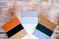 Three multicoloured swatches on wooden background