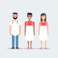 Three multicultural chefs smiling together in uniform. Teamwork in the kitchen with diverse staff. Hospitality industry