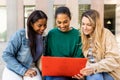 Three multicultural female university students studying together at campus Royalty Free Stock Photo