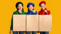 Three Multiethnic Girls Holding Shopper Bags On Yellow Background, Mockup